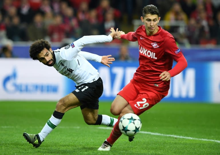Liverpool's forward Mohamed Salah (L) and Spartak Moscow's defender Ilja Kutepov vie for the ball during the UEFA Champions League Group E football match September 26, 2017