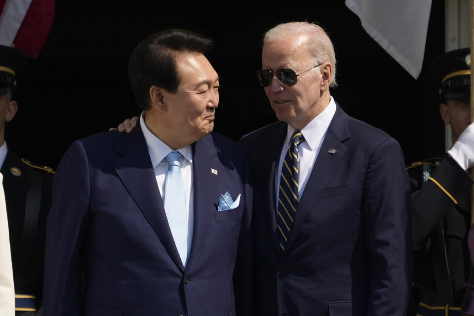 President Joe Biden and South Korea's President Yoon Suk Yeol talk on the Blue Room Balcony during a State Arrival Ceremony on the South Lawn of the White House Wednesday, April 26, 2023, in Washington. (AP Photo/Andrew Harnik)