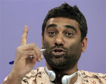 Greenpeace International Executive Director Kumi Naidoo of South Africa gestures during a news conference in Moscow, in this file picture taken August 14, 2012. REUTERS/Maxim Shemetov/Files