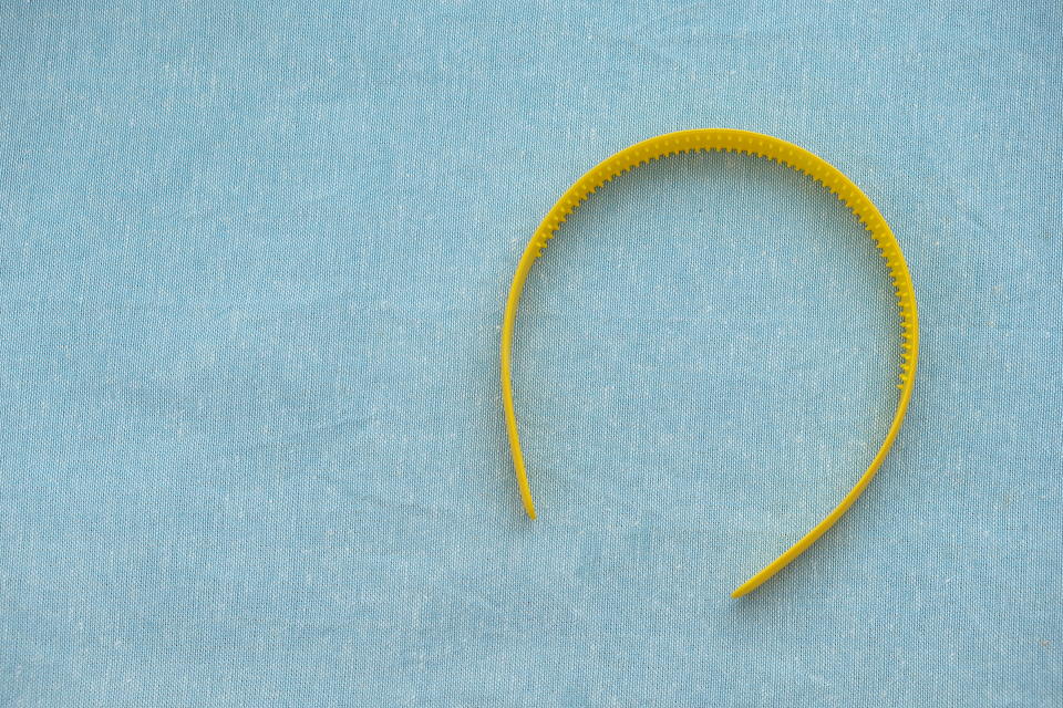 Yellow headband on blue background