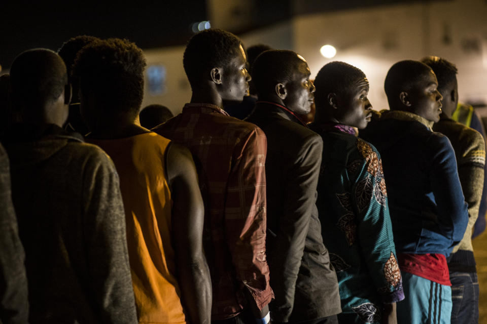 Migrants disembark at Motril port after they were rescued by Spanish NGO ProActiva Open Arms at Alboran Sea, about 40 miles (64 km) from Spanish coasts, on Thursday, Oct. 11, 2018. The Open Arms is now based at Motril port in Spain, in order to start operating in the western Mediterranean area. (AP Photo/Javier Fergo)