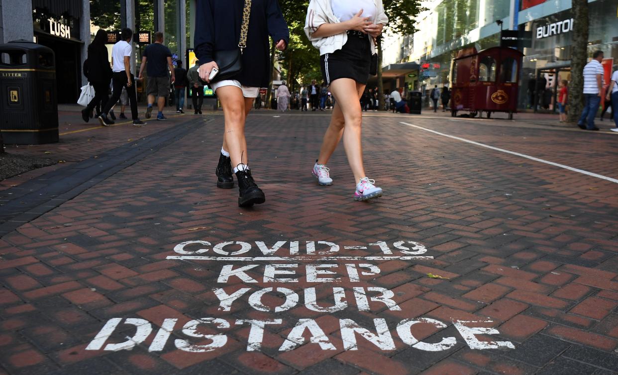 A social distancing public notice on a street in Birmingham (EPA)