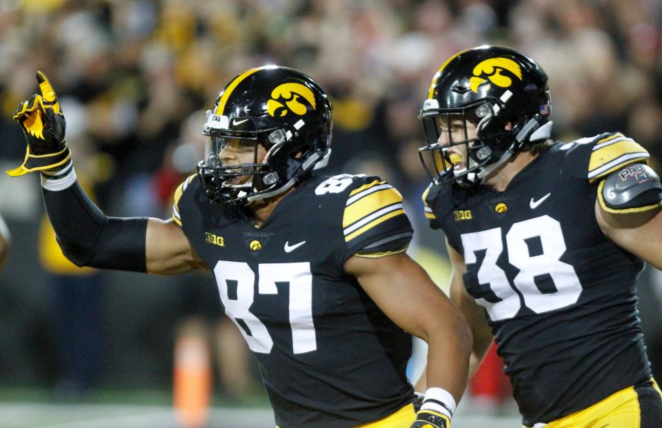 Noah Fant, left, and T.J. Hockenson of the Iowa Hawkeyes celebrate a touchdown against the Wisconsin Badgers on Sept. 22, 2018 at Kinnick Stadium in Iowa City.
