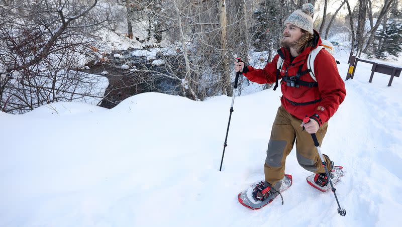 Noah Pirkle snowshoes by the Mill B trailhead in Big Cottonwood Canyon on Monday, Jan. 15, 2024.