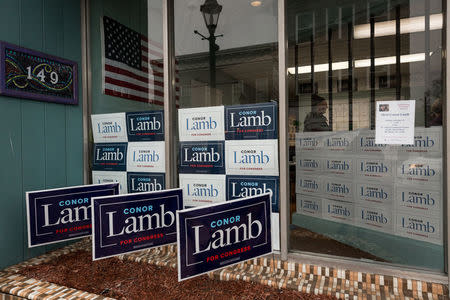 Signs adorn the entrance to Congressional candidate Conor Lamb's headquarters at 149 East High Street in Waynesburg, Pennsylvania, U.S., February 14, 2018. Picture taken February 14, 2018. REUTERS/Maranie Staab
