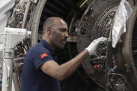 A worker repairs aircraft parts inside Safran Aircraft Engines repair plant outside of Casablanca, Morocco, Thursday, April 18, 2024. Moroccan officials are aiming to turn the country into an aerospace hub, luring investors and manufacturers who have aimed to spread out their supply chains and find willing workers since the COVID-19 pandemic. (AP Photo)