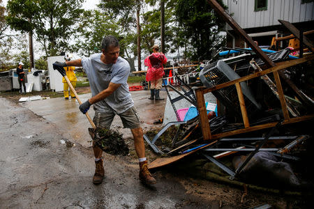 People clean their house after the passing of Hurricane Florence in New Bern, North Carolina, U.S., September 16, 2018. REUTERS/Eduardo Munoz