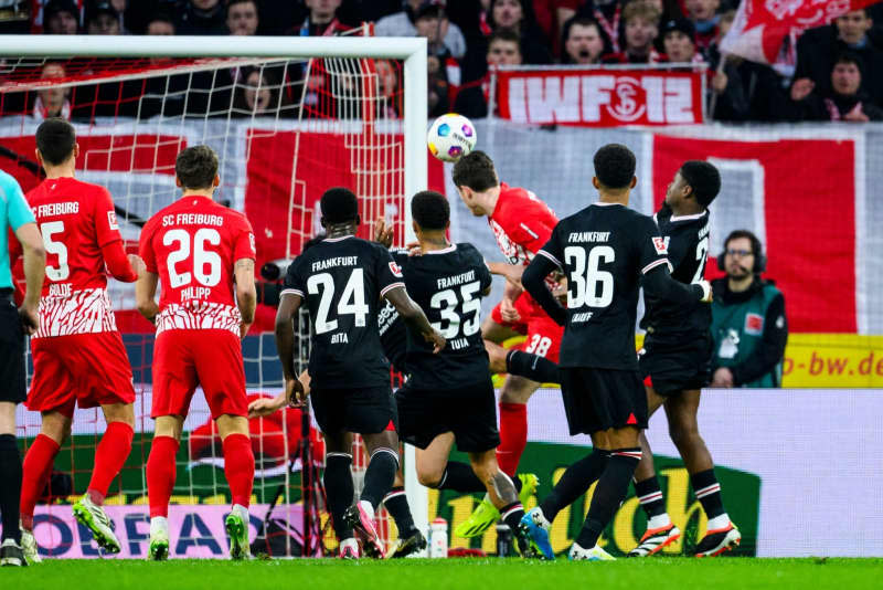 Freiburg's Michael Gregoritsch (3rd R) scores his side's third goal of the game during the German Bundesliga soccer match between SC Freiburg and Eintracht Frankfurt at Europa-Park Stadium. Tom Weller/dpa