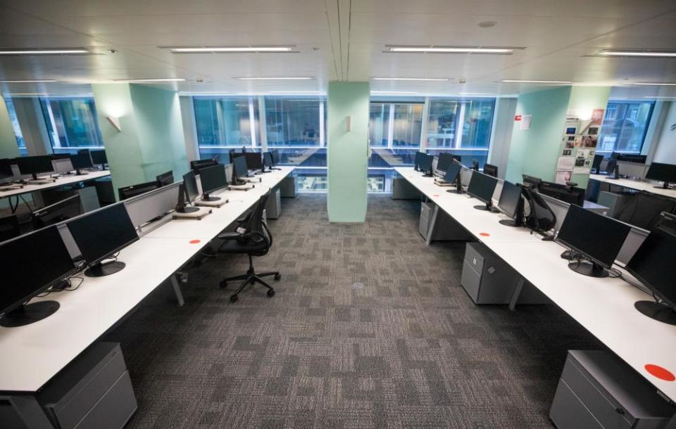 Empty desks stand at Cushman & Wakefield Plc