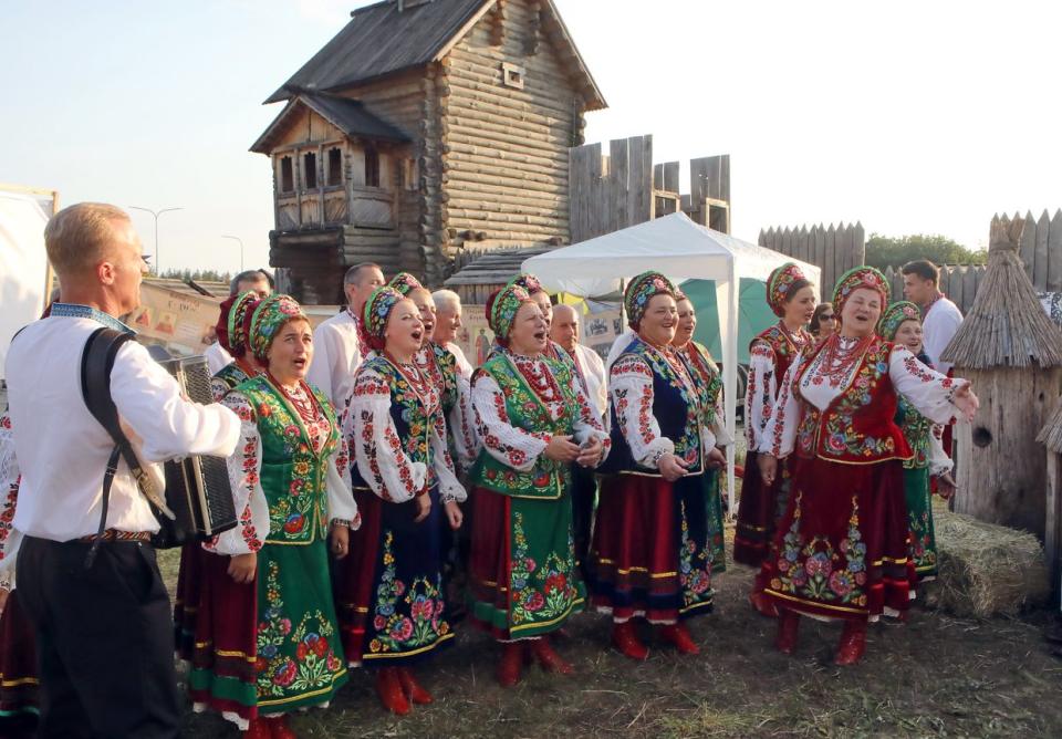 Members of a folk choir in traditional Ukrainian costumes sing during the celebration of the Day of the Christianisation of Kyivan Rus at the Kyivan Rus Park, Kopachiv village, Obukhiv district, Kyiv Oblast, Ukraine, on July 24, 2021. (Volodymyr Tarasov / Ukrinform/Future Publishing via Getty Images)