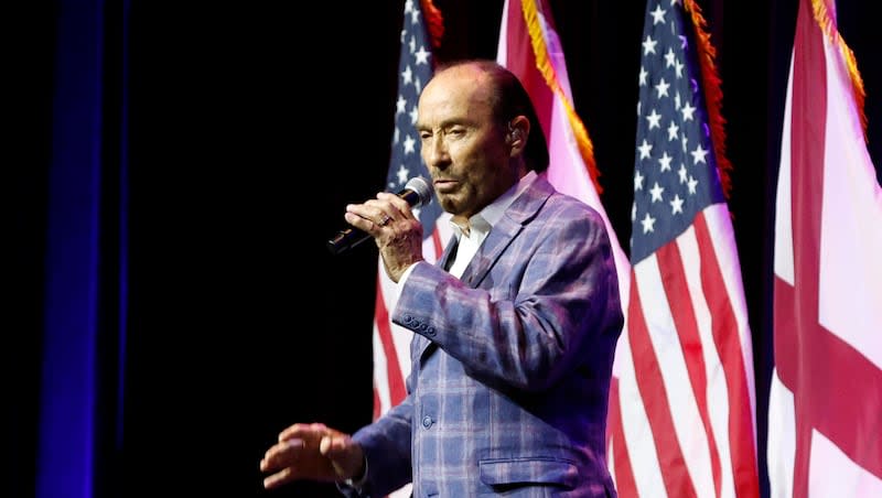 Artist Lee Greenwood sings before former President Donald Trump speaks at a fundraiser event for the Alabama GOP, Friday, Aug. 4, 2023, in Montgomery, Ala.