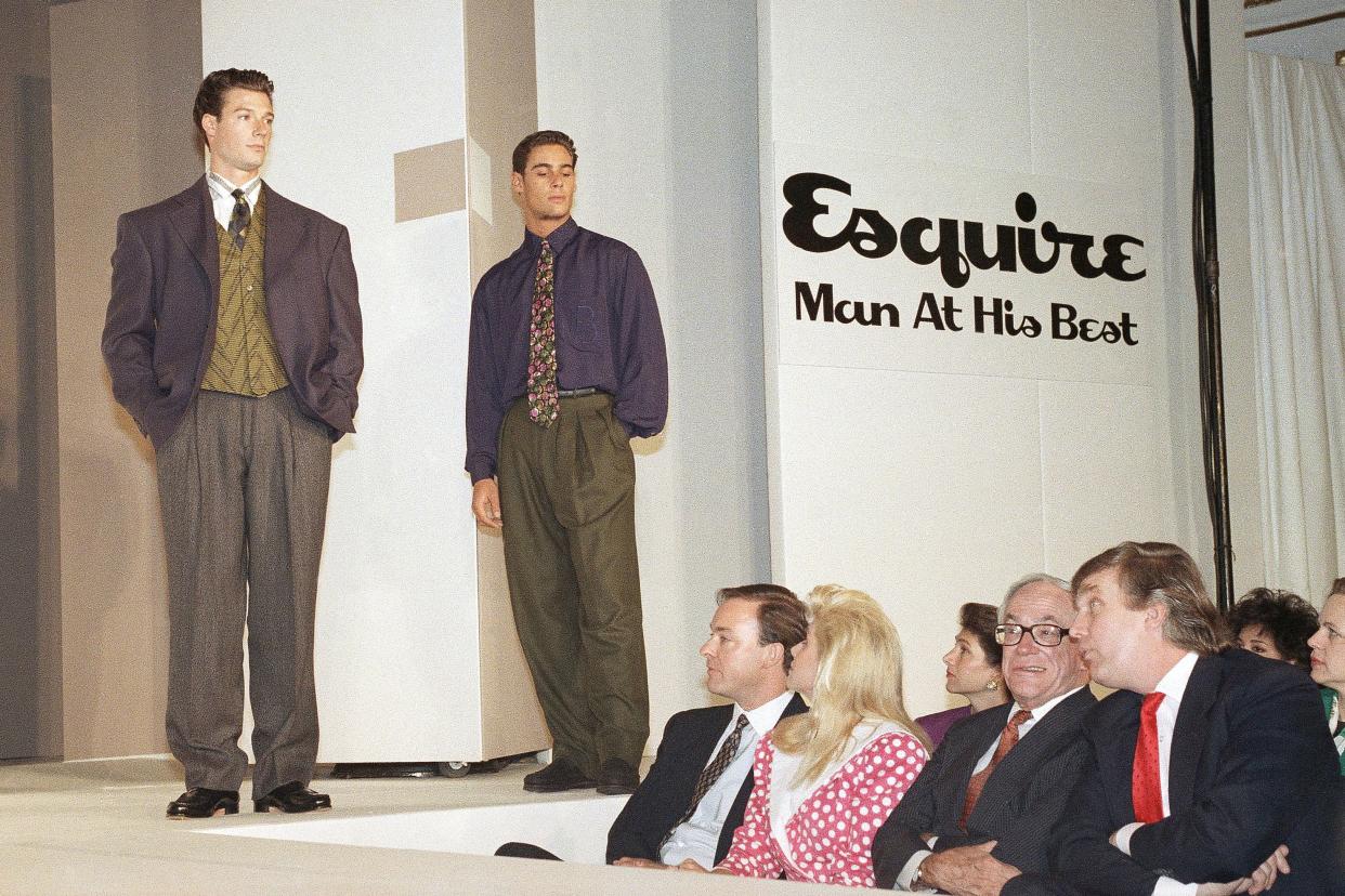 W. Randall Jones, publisher of Esquire Magazine, seated left, and Ivana Trump, second from on August 15, 1989 in New York, while Malcolm Forbes speaks with Donald Trump, right. Esquire saluted American male designers in international fashion at the Plaza Hotel.