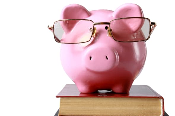 piggy bank with glasses and...