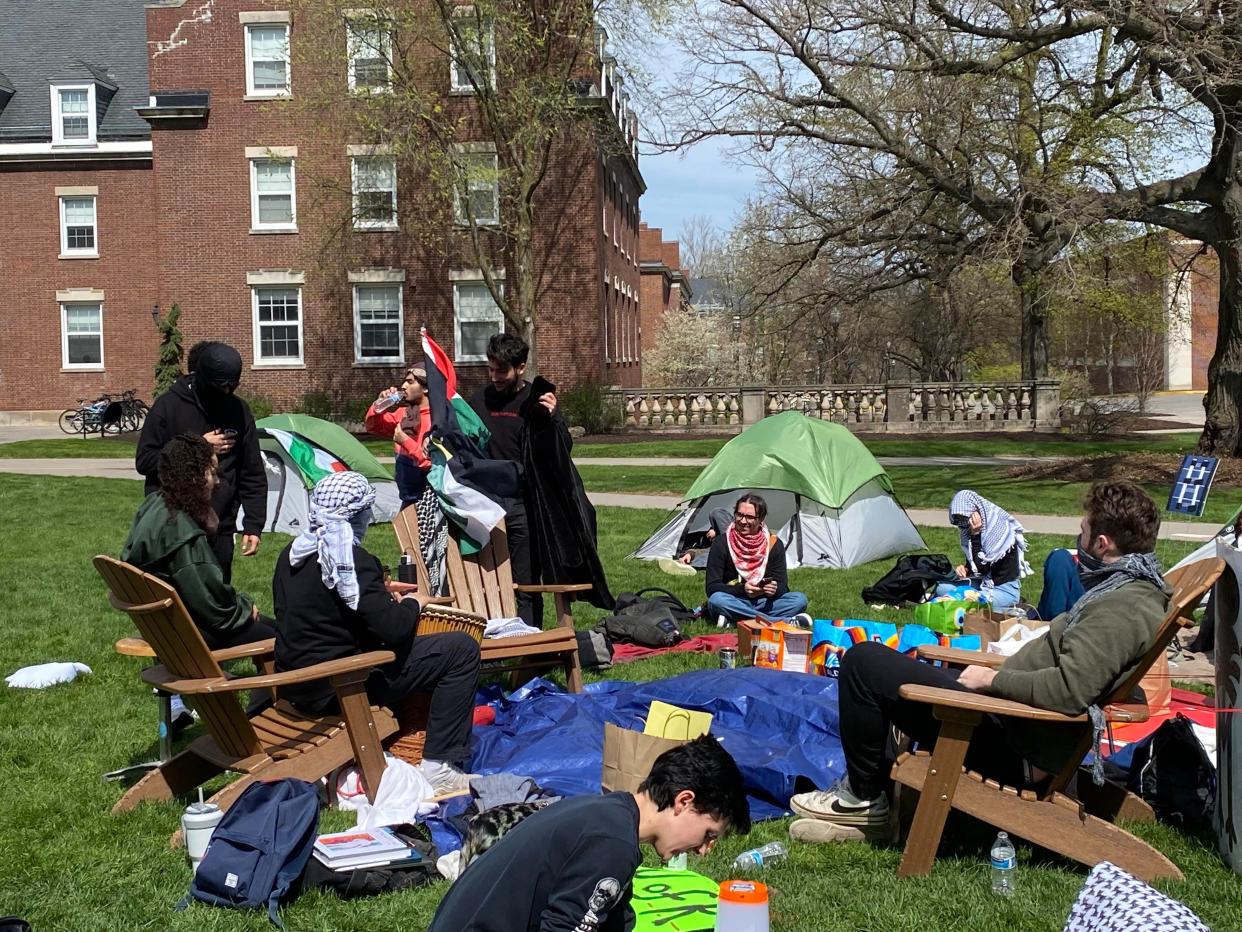 Pro-Palestinian protesters sit at the Wilson Quadrangle at the University of Rochester on April 23, 2024.