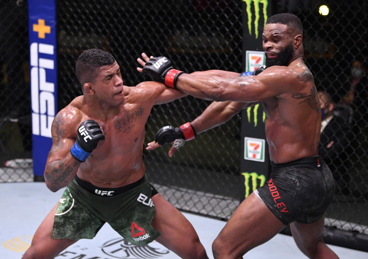 LAS VEGAS, NEVADA - MAY 30: (L-R) Gilbert Burns of Brazil punches Tyron Woodley in their welterweight fight during the UFC Fight Night event at UFC APEX on May 30, 2020 in Las Vegas, Nevada. (Photo by Jeff Bottari/Zuffa LLC)