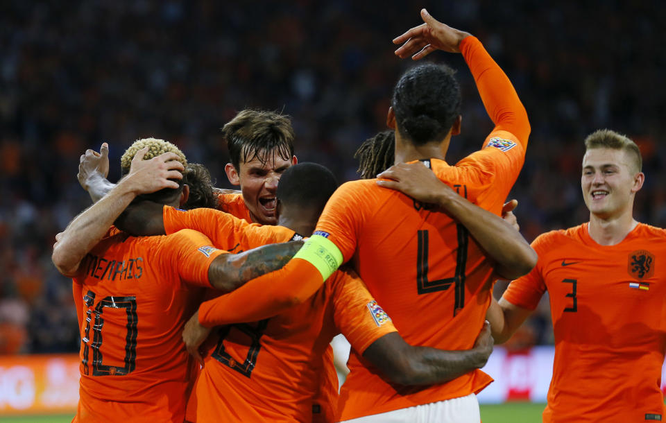 Netherland's players celebrate their third goal during the UEFA Nations League soccer match between The Netherlands and Germany at the Johan Cruyff ArenA in Amsterdam, Saturday, Oct. 13, 2018. (AP Photo/Peter Dejong)