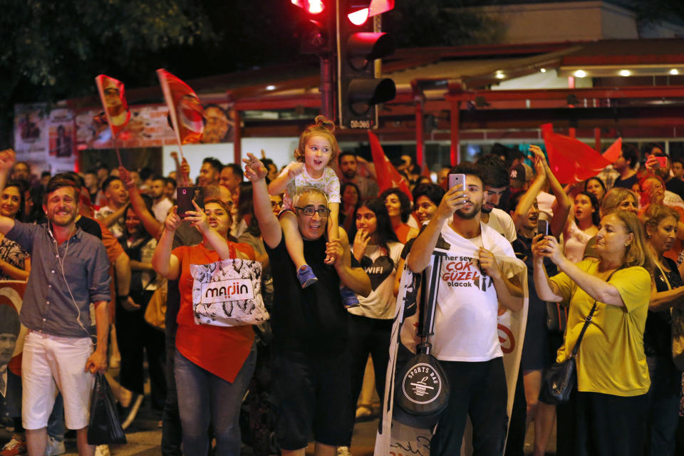 Supporters of Ekrem Imamoglu, the candidate of the secular opposition Republican People's Party, CHP, celebrate in central Istanbul, Sunday, June 23, 2019. In a blow to Turkish President Recep Tayyip Erdogan, Imamoglu declared victory in the Istanbul mayor's race for a second time Sunday after Binali Yildirim, the government-backed candidate conceded defeat in a high-stakes repeat election. (AP Photo/Lefteris Piarakis)