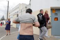 Armenian citizen Vartan Grigoryan poses for a picture outside a detention centre in Minsk