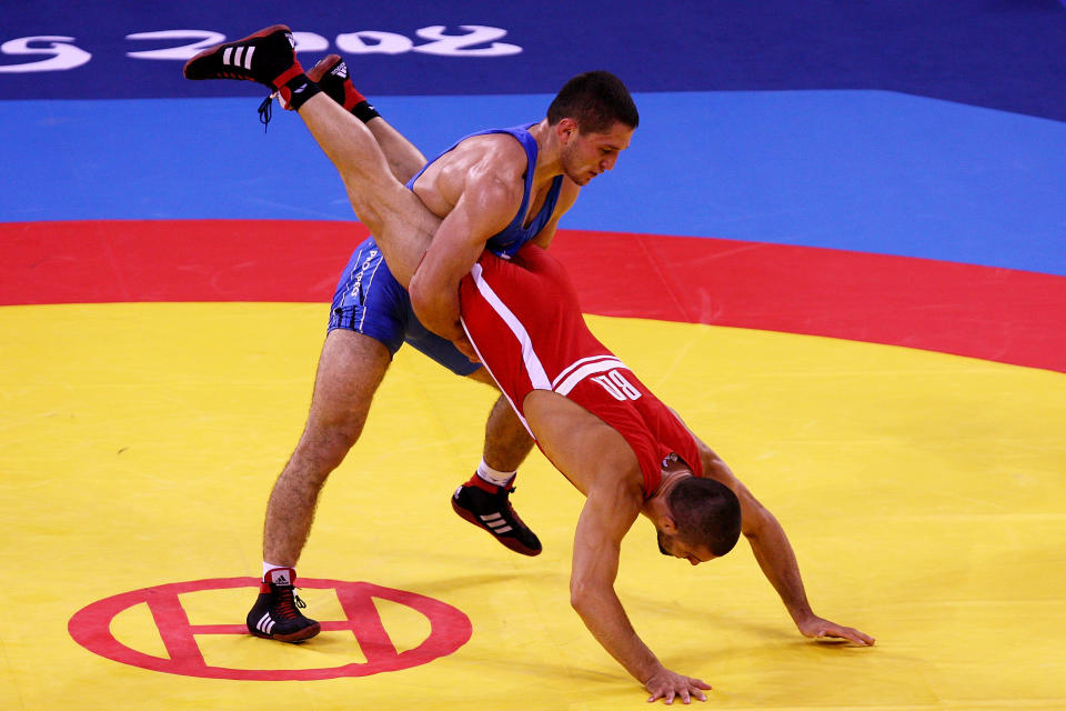 Andriy Stadnik of the Ukraine (blue) wrestles Leonid Spiridonov of Kazakhstan during the Men's Freestyle 66kg Semifinals wrestling event at the China Agriculture University Gymnasium during Day 12 of the Beijing 2008 Olympic Games on August 20, 2008 in Beijing, China. (Al Bello/Getty Images)