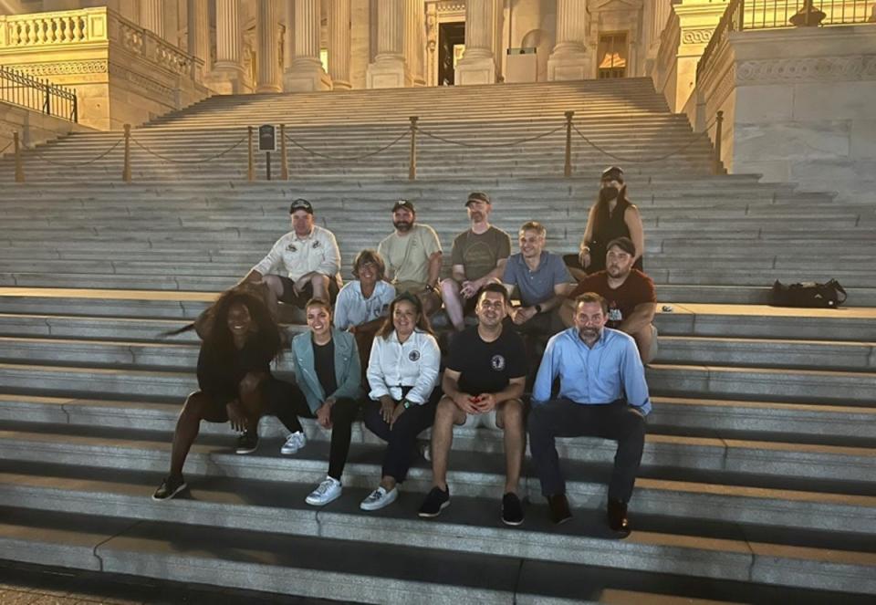 Rosie Torres (centre) with members of the veteran community and lawmakers during the sit in at the Capitol (Burn Pits 360)