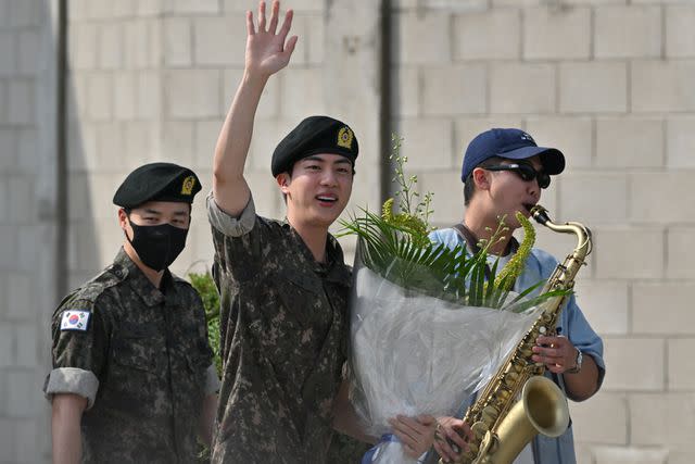 <p>JUNG YEON-JE/AFP via Getty</p> From Left: Jimin, Jin and RM on June 12, 2024