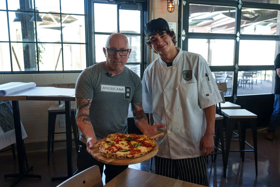 Merkin Vineyards owner and winemaker Maynard James Keenan (left) poses for a photo with 18-year-old chef Kai Miller at the Merkin Vineyards Trattoria on Sept. 25, 2023, in Cottonwood.