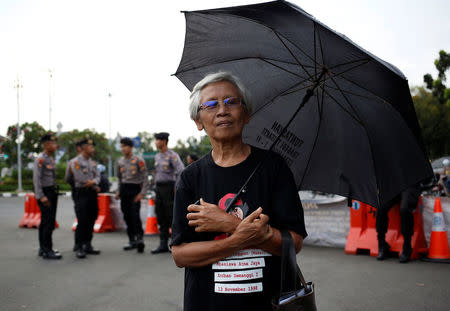 Retired civil servant Maria Catarina Sumarsih, whose son Wawan? was kiiled during the political turmoil of 1998, takes part in a weekly "Kamisan" silent protest against violations of human rights outside presidential palace in Jakarta, Indonesia, May 17, 2018. REUTERS/Willy Kurniawan