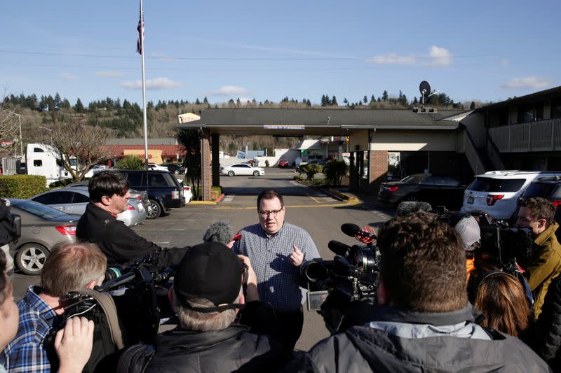 King County Deputy Communications Director Chase Gallagher addresses media after the county announced it is buying an 85-bed Econo Lodge motel to house patients in recovery and isolation for the coronavirus outbreak in Kent, Washington
