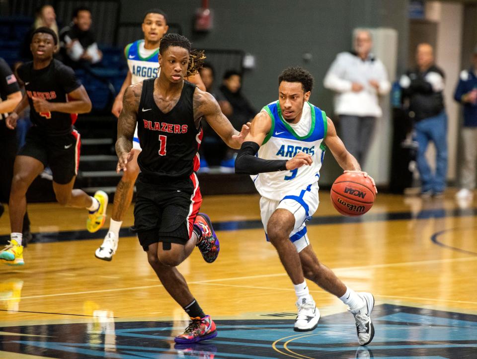 West Florida Argo La Trell Tate (3) drives down court past Valdosta’s Jacolbey Owens (1) goes up for two during second period action against Valdosta State. West Florida beat Valdosta State in overtime 99-97 at The UWF Fieldhouse Saturday, January 8, 2022.