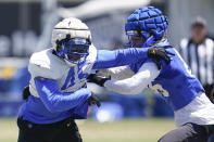 Los Angeles Rams linebacker Bobby Wagner (45) and tight end Kendall Blanton (86) participate in drills at the NFL football team's practice facility in Irvine, Calif. Monday, Aug. 8, 2022. (AP Photo/Ashley Landis)