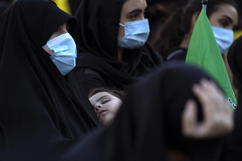 Hezbollah supporters listen to the story of Ashoura, the Shiite Muslim commemoration marking the death of Imam Hussein, the grandson of the Prophet Muhammad, at the Battle of Karbala in present-day Iraq in the 7th century, in southern Beirut, Lebanon, Thursday, Aug. 19, 2021. The leader of the militant Hezbollah group Sayyed Hassan Nasrallah said Thursday that the first Iranian fuel tanker will sail toward Lebanon "within hours" warning Israel and the United States not to intercept it. (AP Photo/ Hassan Ammar)