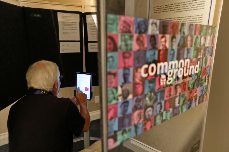 Charles R. Chace, VP of Descendants of Whaling Masters, participates in the Common Ground project set up at a gallery inside of the Whaling Museum.