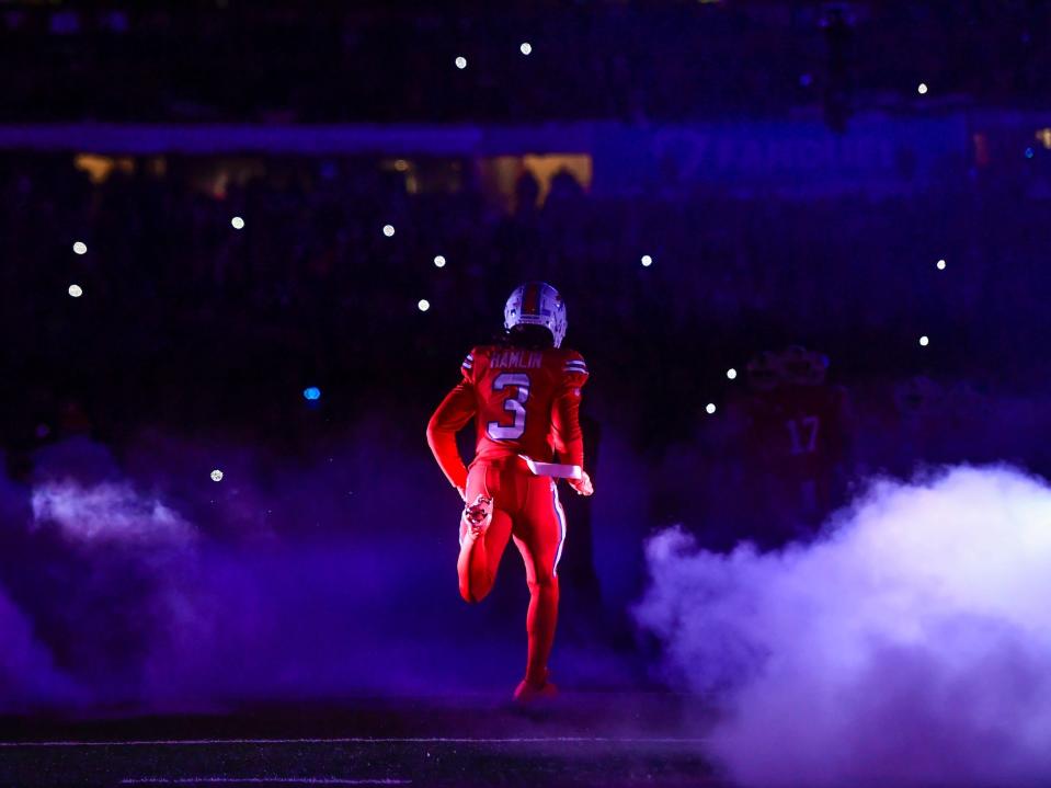 Damar Hamlin runs onto the field.