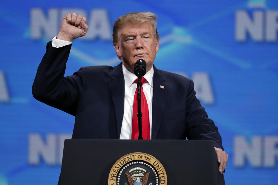 FILE - In this April 26, 2019, file photo, President Donald Trump speaks at the National Rifle Association Institute for Legislative Action Leadership Forum in Lucas Oil Stadium in Indianapolis. The NRA sued San Francisco on Monday, Sept. 9, 2019, over the city's recent declaration that the gun-rights lobby is a "domestic terrorist organization." Democrat leaders in Congress on Monday urged Trump, a favorite of the NRA, to push Republicans to agree to expand background checks, and there have been efforts to make it easier to seize firearms at least temporarily from people who are exhibiting mental health issues. (AP Photo/Michael Conroy, File)