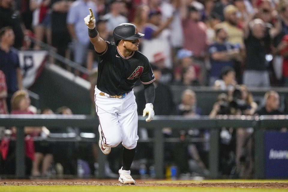 Arizona Diamondbacks' Gabriel Moreno hits a RBI-single against the Philadelphia Phillies during the eighth inning in Game 4 of the baseball NL Championship Series in Phoenix, Friday, Oct. 20, 2023. (AP Photo/Brynn Anderson)