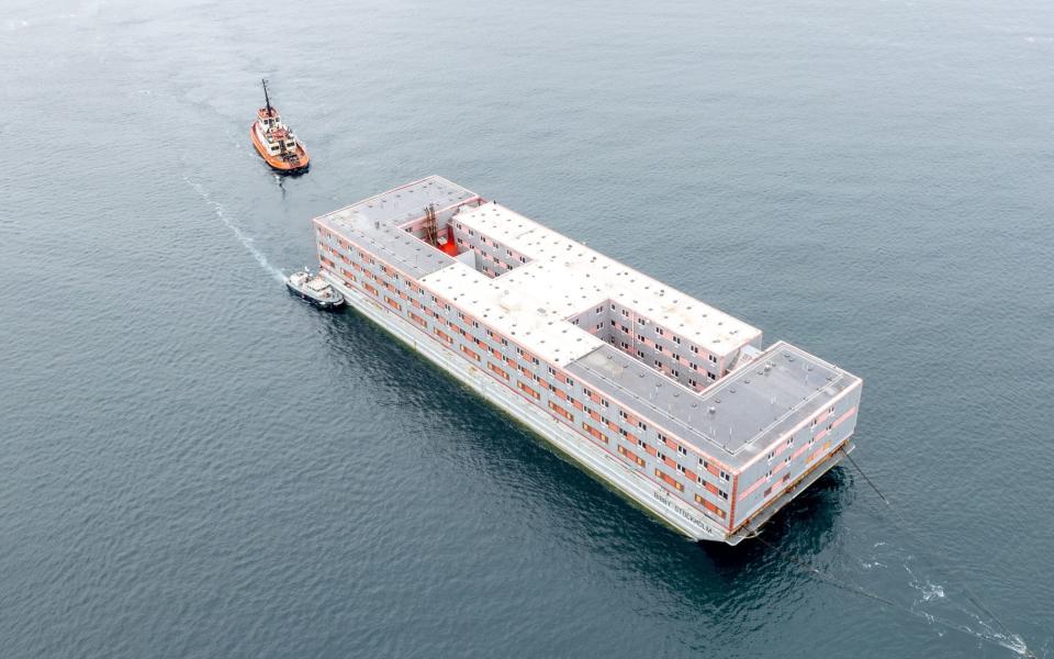 The three-storey vessel will house around 500 migrants - PA