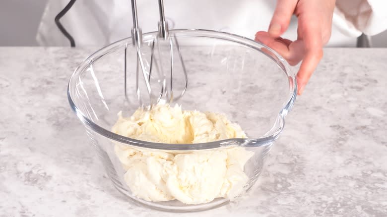 Whipping icing in bowl 