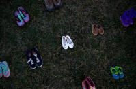 <p>Activists install 7000 shoes on the lawn in front of the U.S. Capitol on Capitol Hill in Washington, U.S. March 13, 2018. Organizers said the installation represents the number of lives lost since the shooting at Sandy Hook elementary in Newtown, Connecticut. (Photo: Eric Thayer/Reuters) </p>