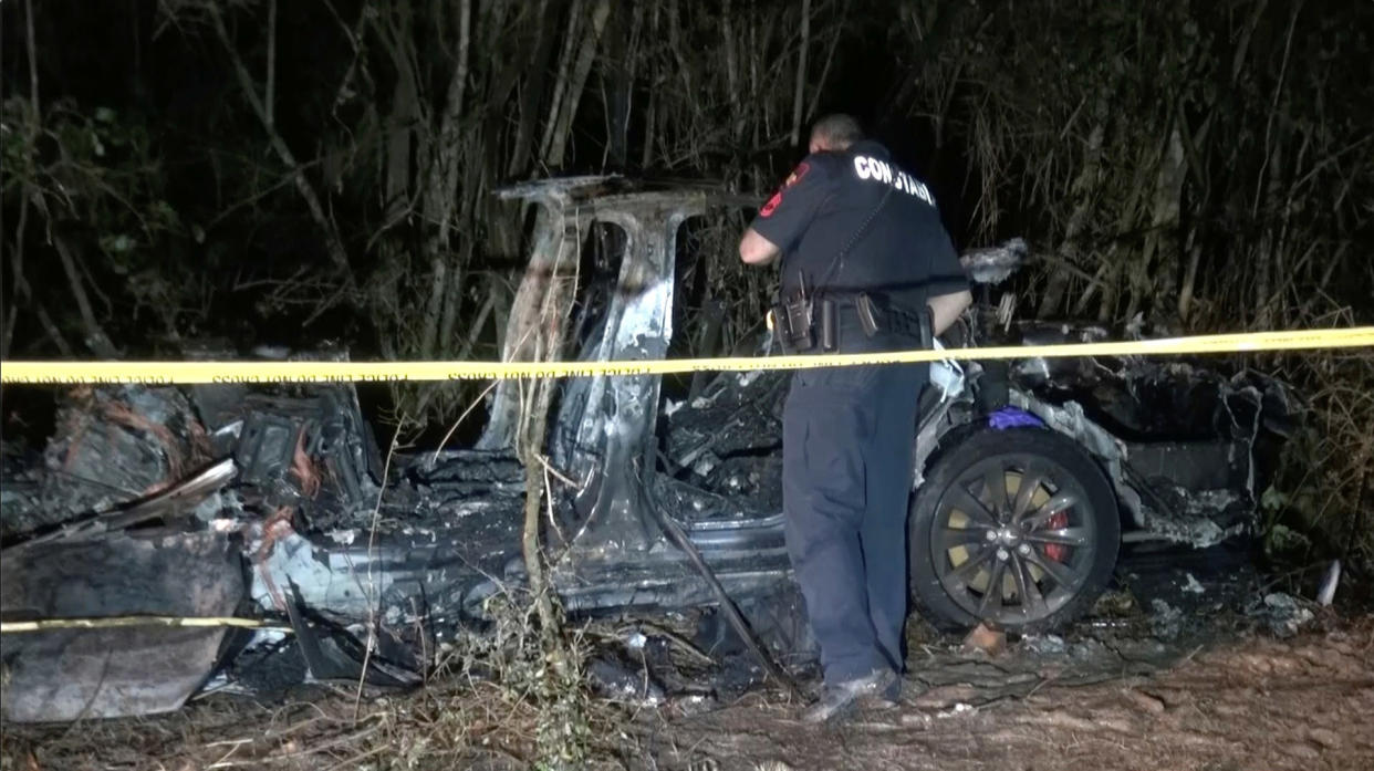 The remains of a Tesla vehicle are seen after it crashed in The Woodlands, Texas (Scott J. Enlge / via Reuters)