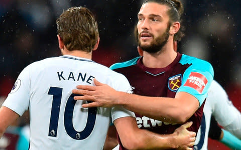 Andy Carroll pats Harry Kane on the back - Credit: AFP