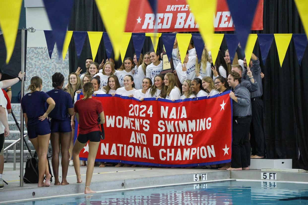 Keiser women's swimming team celebrates its third consecutive NAIA national championship last Sunday.