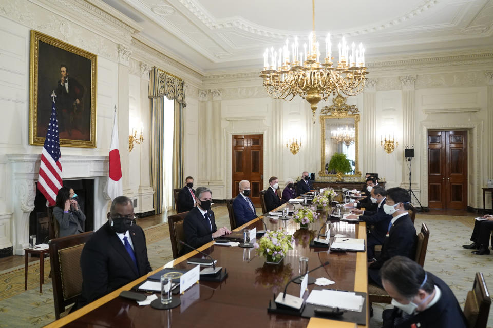 President Joe Biden meets with Japanese Prime Minister Yoshihide Suga in the State Dining Room of the White House, Friday, April 16, 2021, in Washington. At left is Defense Secretary Lloyd Austin and Secretary of State Antony Blinken. (AP Photo/Andrew Harnik)