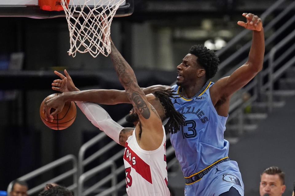 Memphis Grizzlies forward Jaren Jackson Jr. (13) blocks a shot by Toronto Raptors guard Gary Trent Jr. during the second half of an NBA basketball game Saturday, May 8, 2021, in Tampa, Fla. (AP Photo/Chris O'Meara)