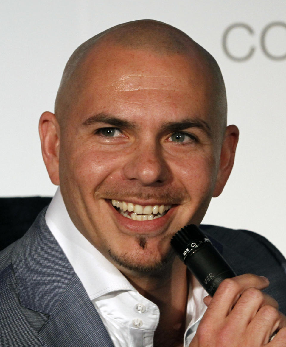 Miami rapper Pitbull smiles during an interview in Miami, Wednesday, April 25, 2012. (AP Photo/Alan Diaz)