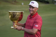 USA team captain Davis Love III holds the Presidents Cup trophy after team USA defeated the International team in match play at the Presidents Cup golf tournament at the Quail Hollow Club, Sunday, Sept. 25, 2022, in Charlotte, N.C. (AP Photo/Chris Carlson)