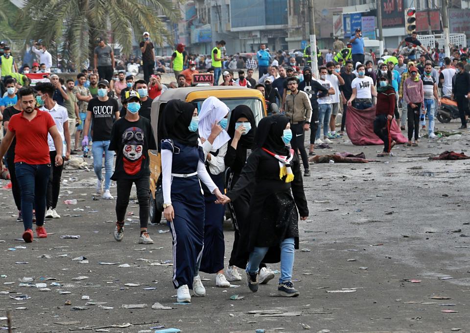 Anti-government protesters gather in Tahrir Square during a demonstration in Baghdad, Iraq, Sunday, Oct. 27, 2019. Protests have resumed in Iraq after a wave of anti-government protests earlier this month were violently put down. At least 149 people were killed in a week of demonstrations earlier in October. (AP Photo/Hadi Mizban)