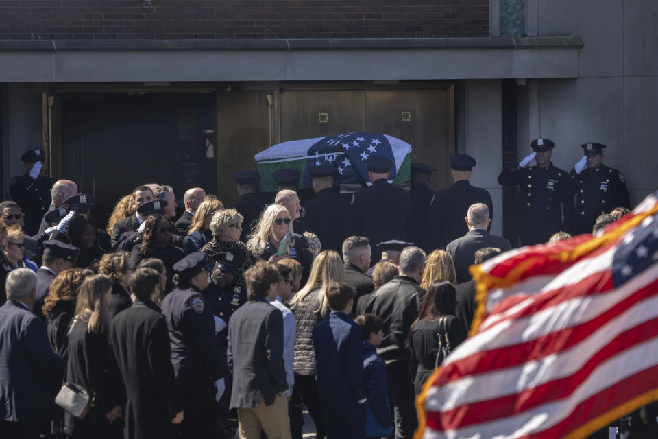 Police officers carry the casket during a funeral service for New York City Police Department officer Jonathan Diller at Saint Rose of Lima R.C Church in Massapequa Park, N.Y., on Saturday, March 30, 2024. Diller was shot dead Monday during a traffic stop. He was the first New York City police officer killed in the line of duty in two years.(AP Photo/Jeenah Moon)