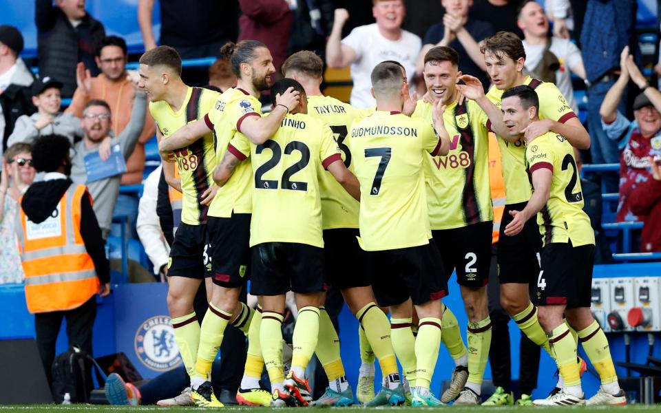 Burnley's players celebrate their second equaliser at Chelsea