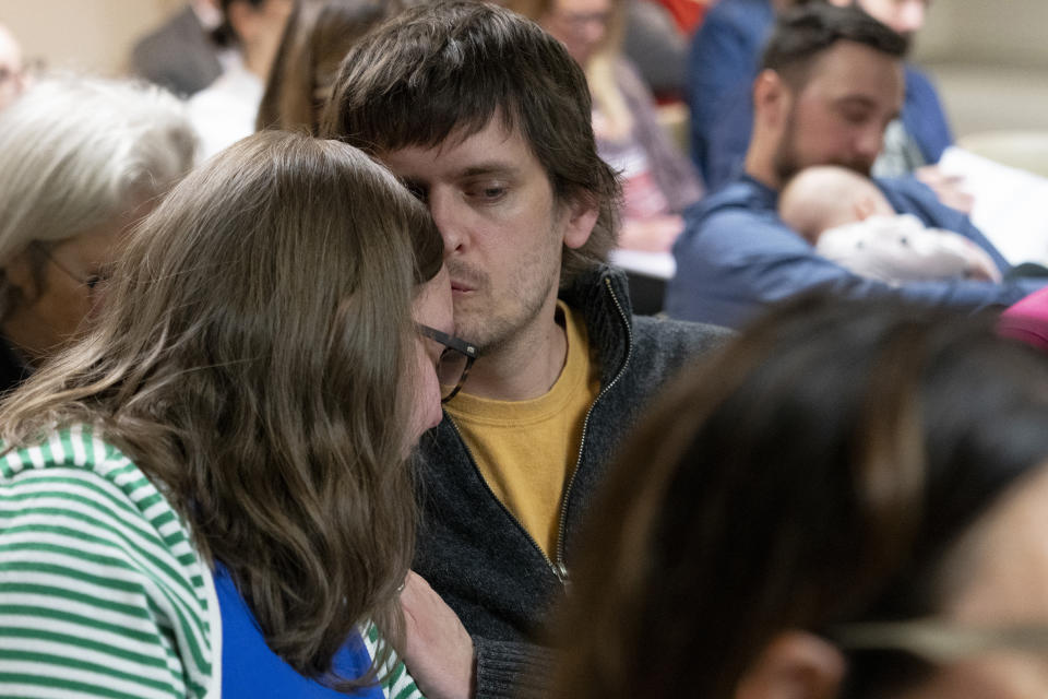 Seth Fulton, right, comforts his wife Rachel Fulton, a plaintiff in the Nicole Blackmon vs. the State of Tennessee, as she listens to arguments presented by her attorney in court, Thursday, April 4, 2024, in Nashville, Tenn. The case challenges the medical necessity exception to Tennessee's total abortion ban. (AP Photo/George Walker IV)