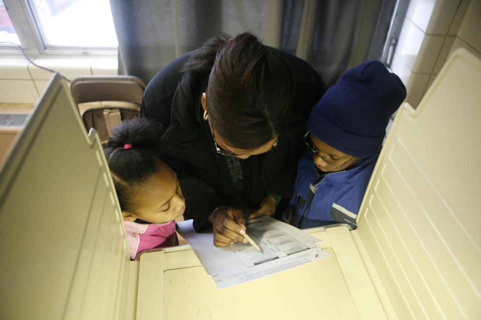 A mom votes with her kids